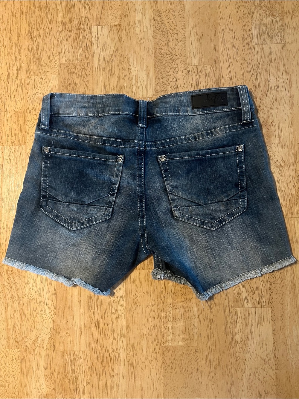Daytrip Women's Distressed Denim Cutoff Shorts in Blue Wash